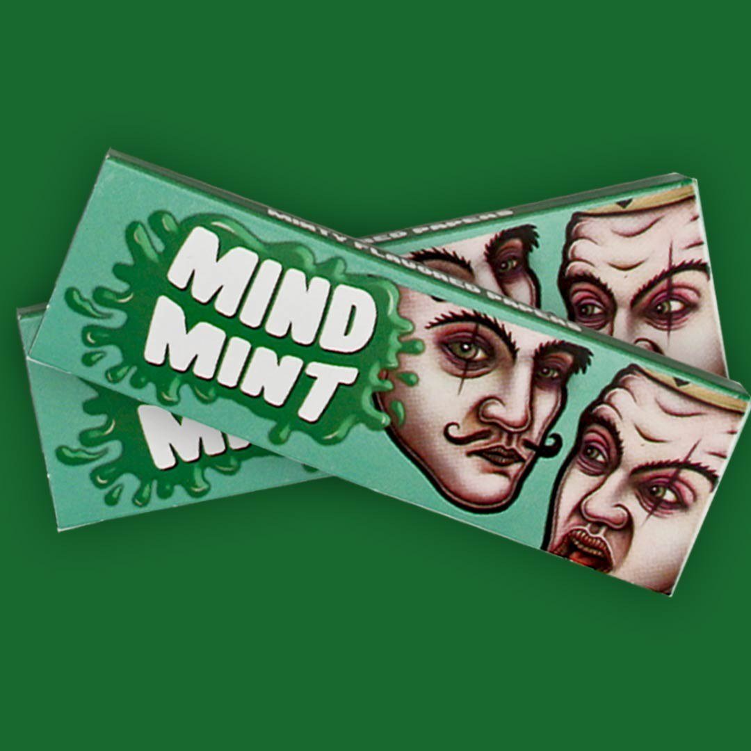 Cueros Papeles Lion Rolling Circus Mind Mint #9: dos librillos sobre un fondo verde